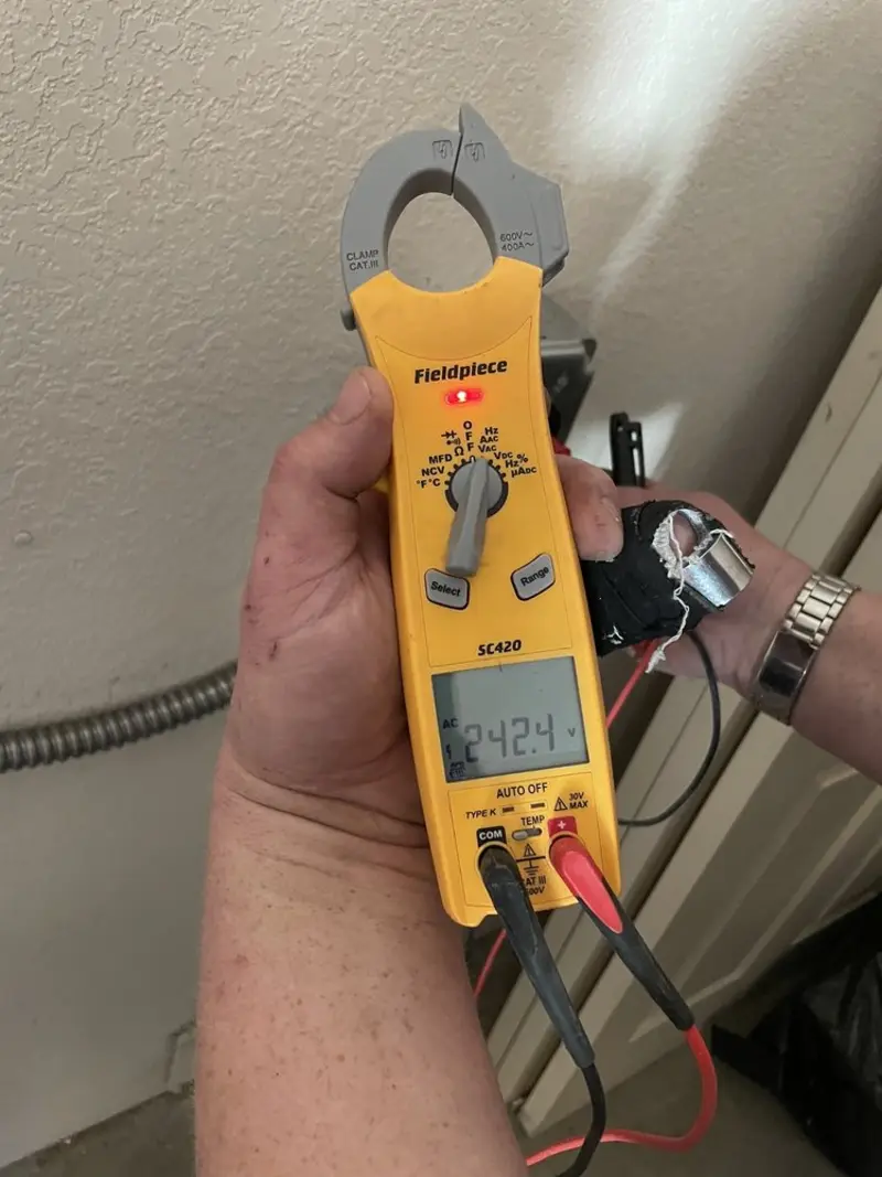 Voltage testing with clamp meter during Ceiling Fan Installation in Fairview